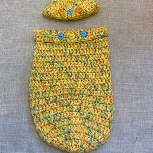 Crocheted baby hat with matching cocoon.